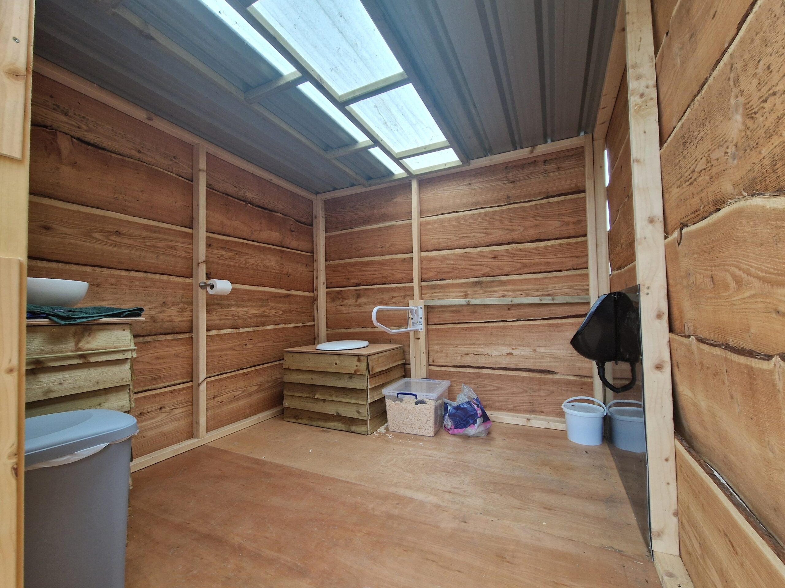 Extra Large Accessible Toilet Including a Sink & Urinal.